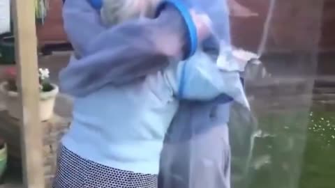 When propaganda replaces truth, people hug through plastic.