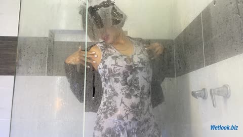 Wetlook girl in shower in dress