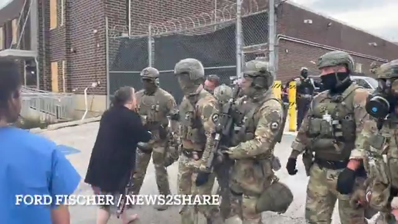 Elderly Protester Confronts ICE Officers at Detention Facility Gate