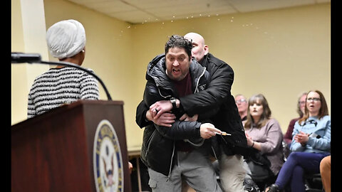 Man Sprays Ilhan Omar with Unknown Liquid During Minneapolis Town Hall