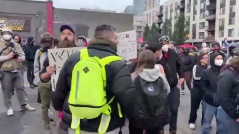 Near the encampment at the Portland ICE facility, walking on a public sidewalk