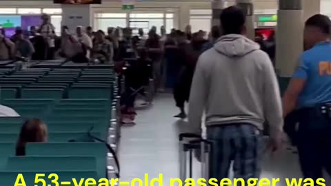 A 53-year-old passenger was shot by police on Wednesday afternoon after he allegedly threatened