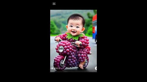 cute baby play with red grapes cycle