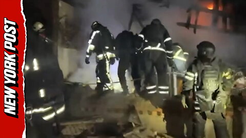 Rescue workers try to retrieve bodies after Russian drone strike kills four, including three children