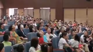 A teacher showing his paper aeroplane