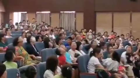 A teacher showing his paper aeroplane