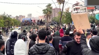 Syrian forces fire guns to disperse protests in Alawite heartland