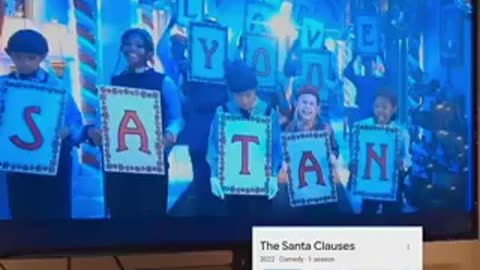 Disney Christmas comedy in which children hold the sign "We Love You Satan"