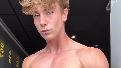 Handsome muscular man showing off his muscles