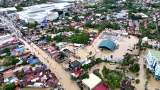 Roads, buildings flooded after typhoon thrashes the Philippines
