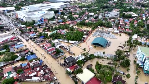 Roads, buildings flooded after typhoon thrashes the Philippines