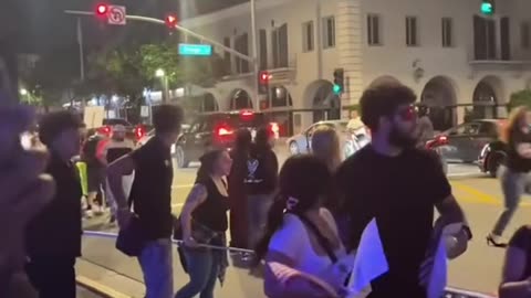 From a different angle on the protest, crazy driver