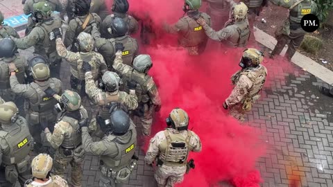 Katie Daviscourt Portland, Ore. — A Blackhawk helicopter flys above the ICE facility
