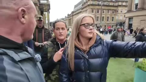 UK: Proud 16 year old girl has her flag snatched from her hands by a police officer..