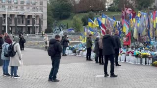 Zelenskyy Laying Flowers at a Memorial During a Moment of Silence