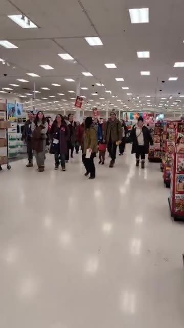 Protesters walk through Target in Richfield, Minnesota chanting “F ICE”