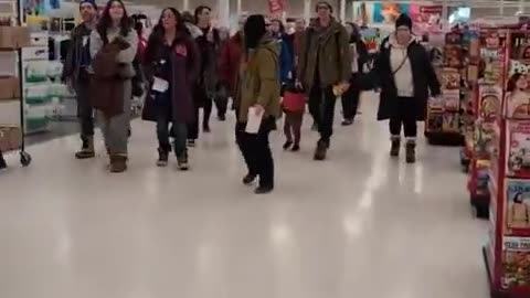 Protesters walk through Target in Richfield, Minnesota chanting “F ICE”