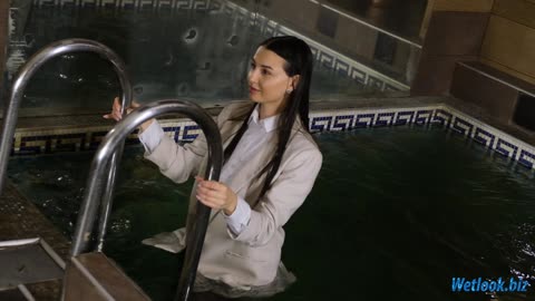 Wetlook girl dressed in stylish leather pants, leather boots