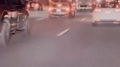 Dashcam footage shows a truck plunging off an overpass onto a freeway in Rialto, California