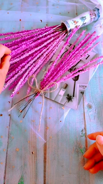 Hands Holding Bundle of Vibrant Purple Dried Flowers