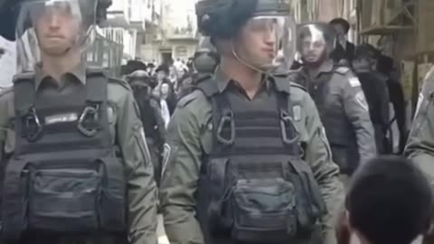 Ultra-Orthodox Jews protest in Jerusalem and hold up the Palestinian flag