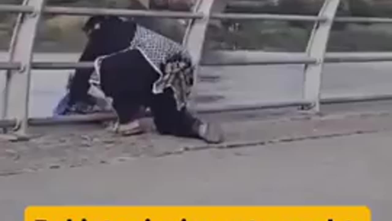 A Pakistani migrant casually dumps rubbish in the River Clyde in Glasgow