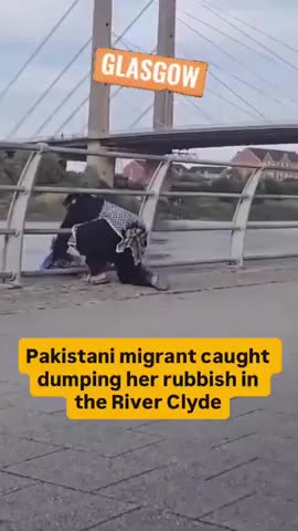 A Pakistani migrant casually dumps rubbish in the River Clyde in Glasgow