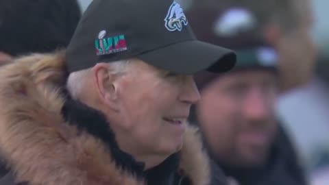 Former President Joe Biden rocking an Eagles hat on sideline