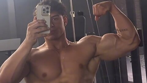 17 years old teen boy flexing big biceps