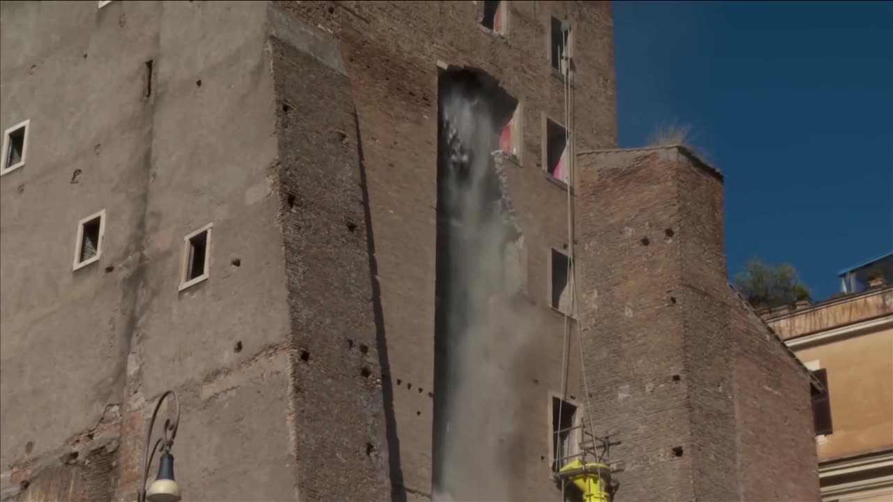 A medieval tower in Rome partially collapses with a firefighter inside
