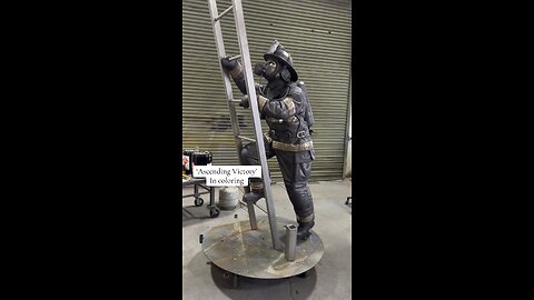 “Ascending Victory” firefighter climbing a ladder