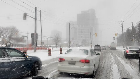 Cars Struggle to Climb Icy Hill During Toronto Snowfall