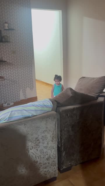 Little Girl Sneaks Past Pink Alien