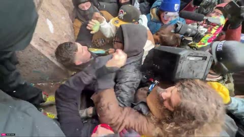 🔥🚨 BREAKING: Conservative activist Jake Lang is PULLED into a crowd of rioters...