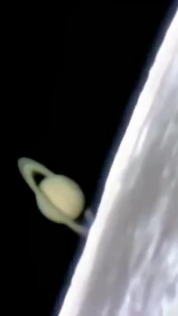 authentic footage showing Saturn emerging from behind the Moon