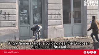 Angry farmers target a building near the European Parliament in Brussels