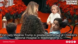 First Lady Melania Trump is greeted with a hug at Children's National Hospital in Washington, DC