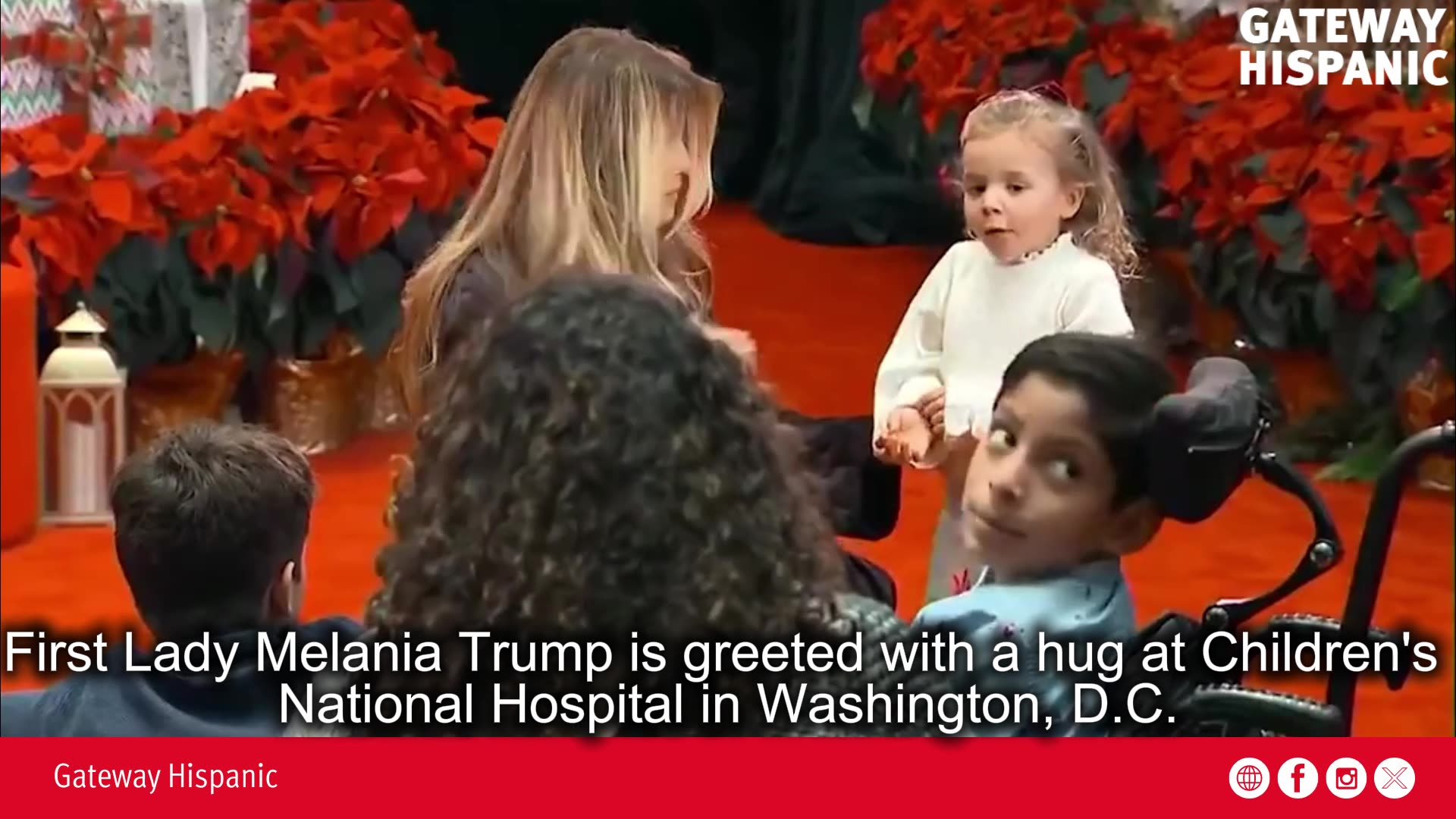 First Lady Melania Trump is greeted with a hug at Childrens National Hospital in Washington, DC