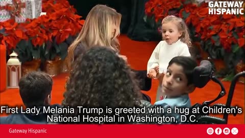 First Lady Melania Trump is greeted with a hug at Children's National Hospital in Washington, DC
