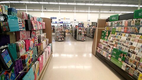 Guy w 6 Hats on At Meijer