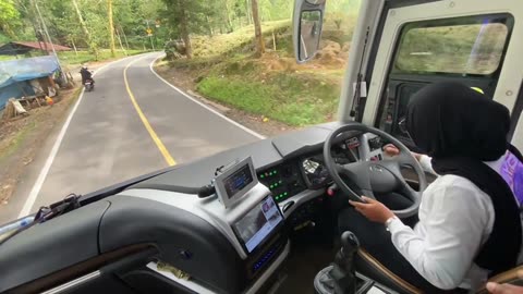 beautiful woman becomes a tourist bus driver