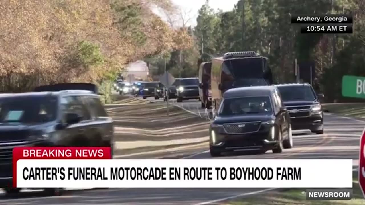 Jimmy Carter’s motorcade passes his boyhood home for the last time