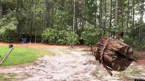 Man Throws Axes At Suspended Log