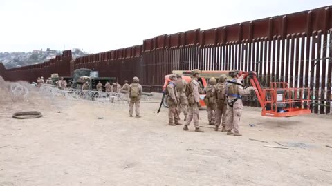 U.S. Marines deploy concertina wire along southern border wall during security mission