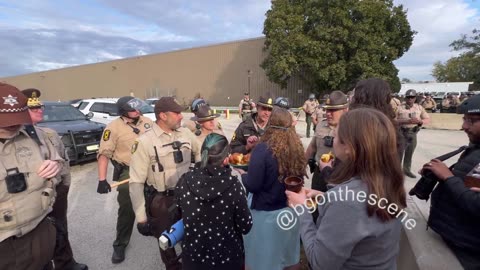 A few demonstrators attempt to bring communion to detainees at the Broadview ICE facility,
