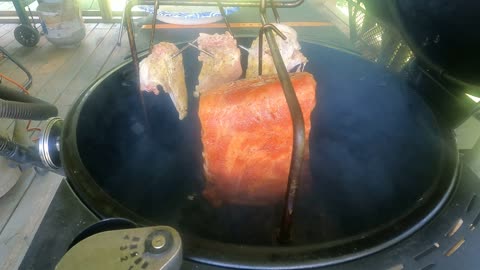 Hanging Baby Back Ribs And Chicken Breast On The OJ's Bronco