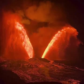 Kilauea volcano in Hawaii erupts, producing a striking wing-shaped burst of Lava