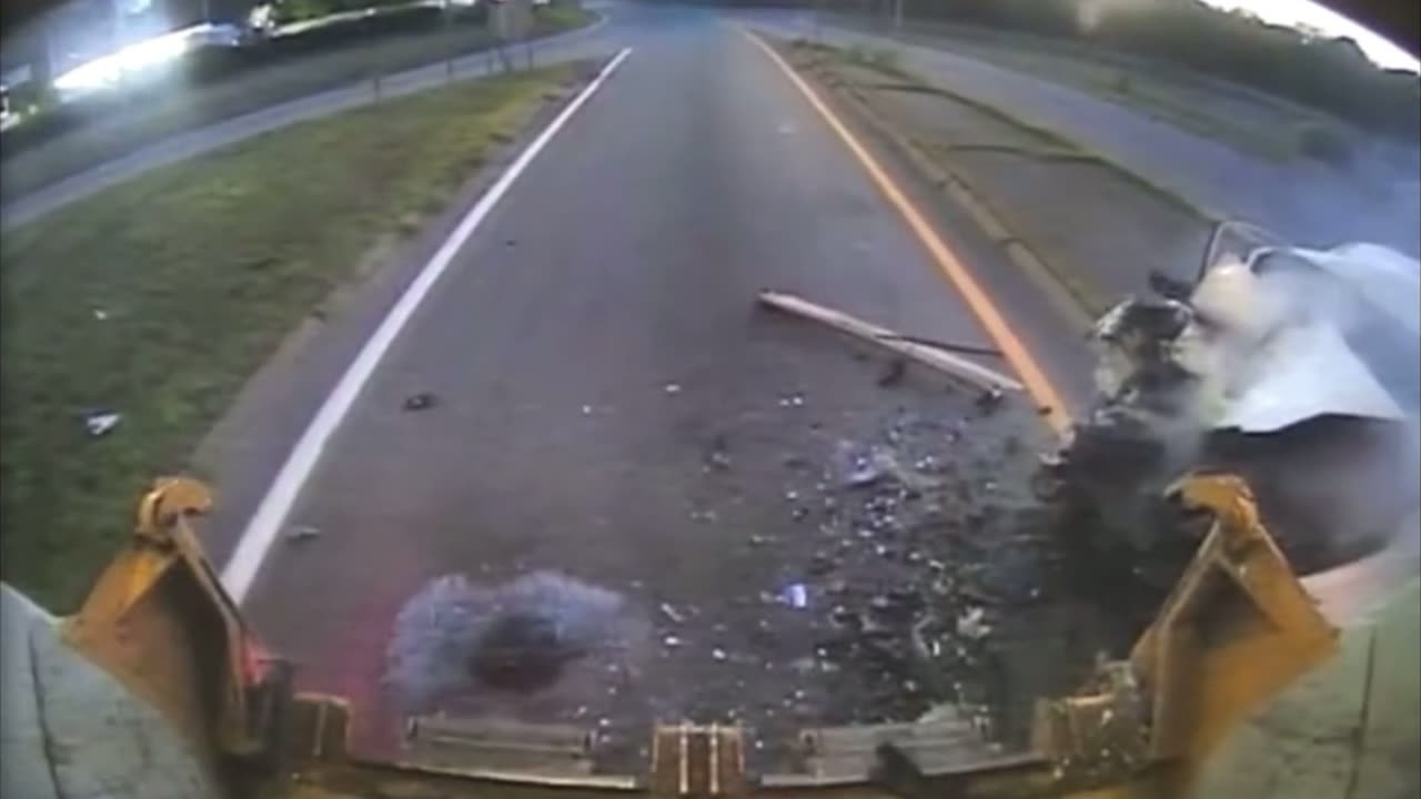A car traveling at high speed rear-ends a garbage truck