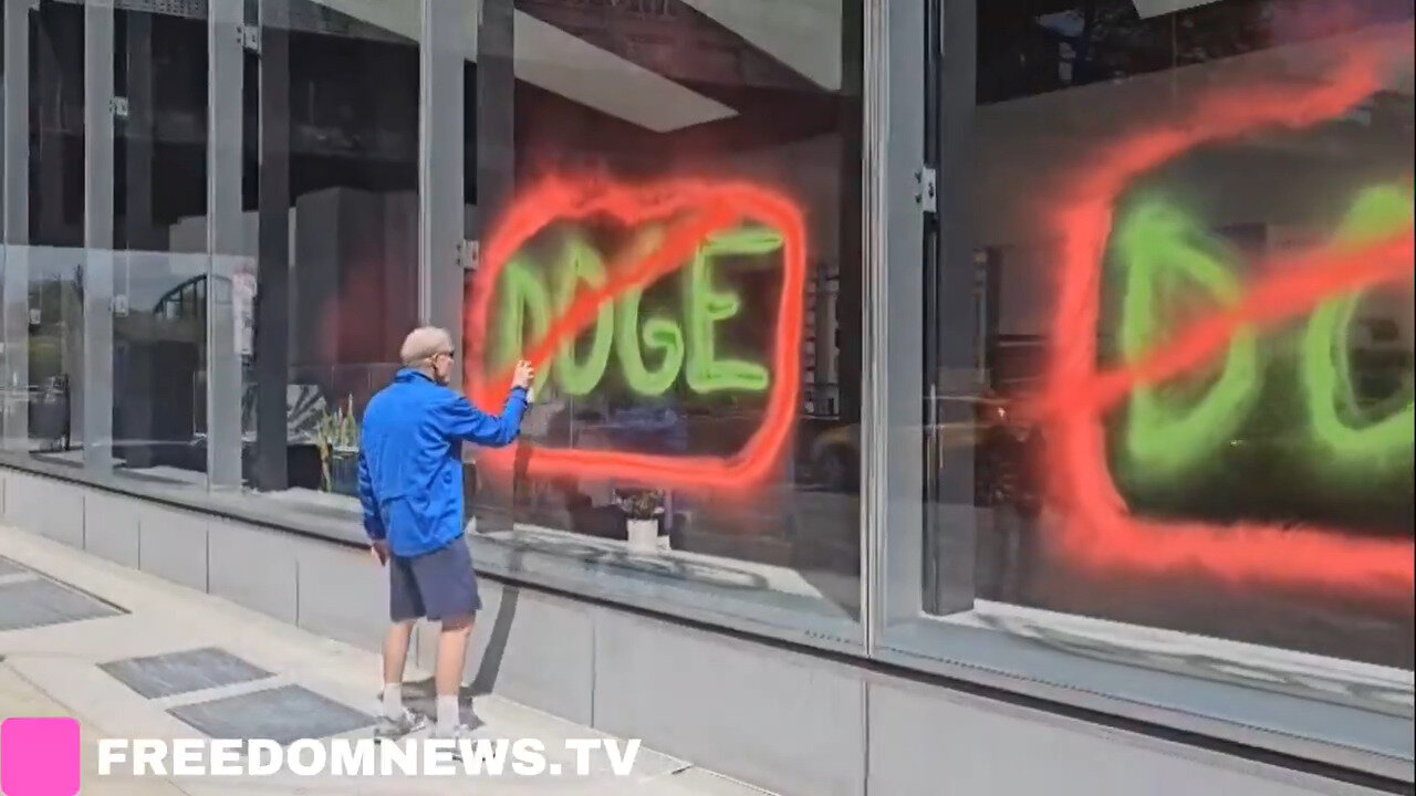 Climate Activists Tag Windows Of Tesla Showroom In Manhattan On Earth Day