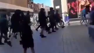 An Islamic stand handing out Koran in Liverpool was swept away by British patriots.